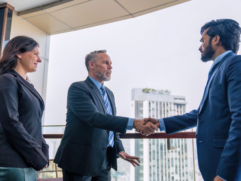 Chief executive officer with secretary meet up with business man at the rooftop balcony discuss on business investment